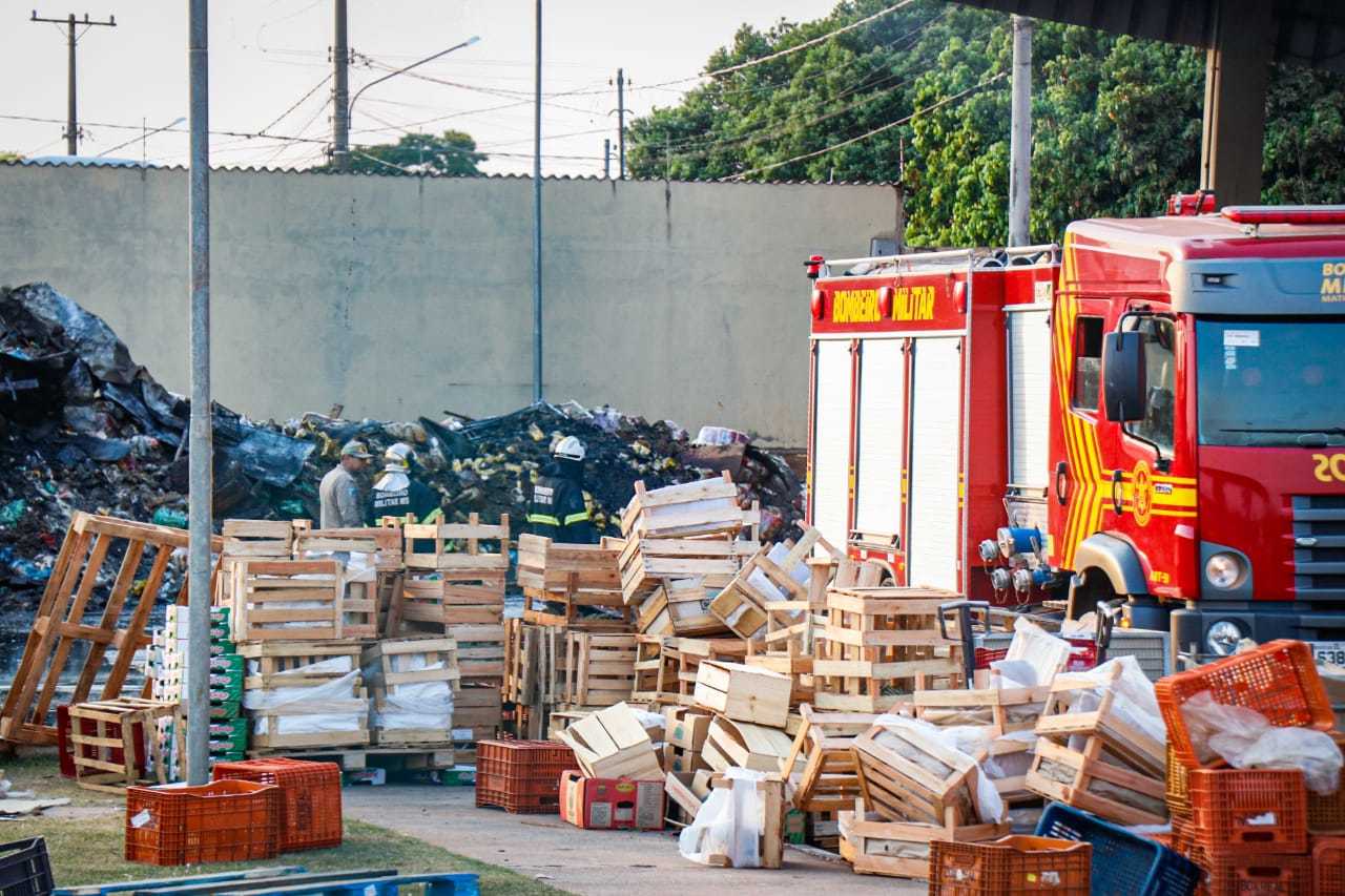 In the background, a mountain of burned material. 